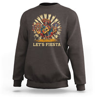 Dark chocolate sweatshirt with “Let’s Fiesta” graphic of dancing skeletons