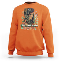 Orange crewneck sweatshirt with colorful Cinco de Mayo graphic on front