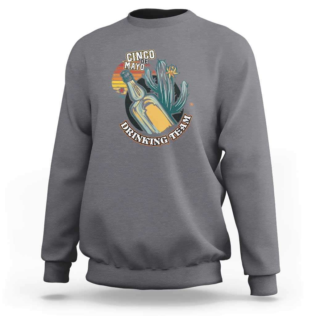 Charcoal gray crewneck sweatshirt with colorful “Cinco Made” boot graphic on the chest