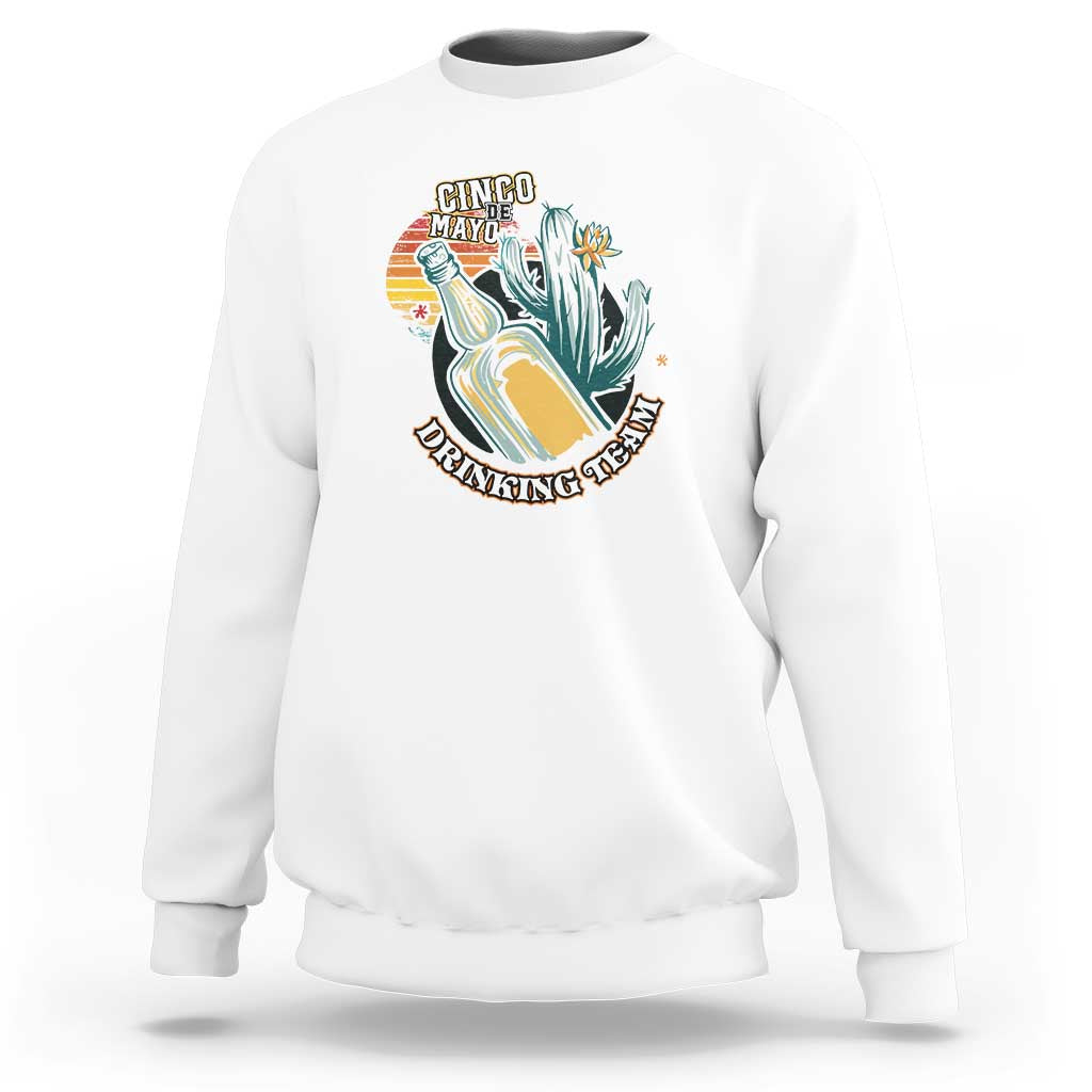 White crewneck sweatshirt with colorful “Cinco Made” boot graphic on the chest