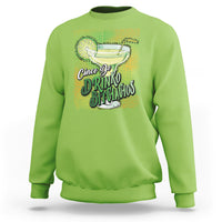 Lime green crewneck sweatshirt with colorful drink and text graphic on front