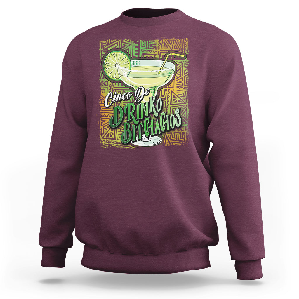 Maroon crewneck sweatshirt with colorful drink and text graphic on front
