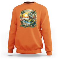 Orange sweatshirt with colorful iguana Cinco de Mayo graphic on the chest