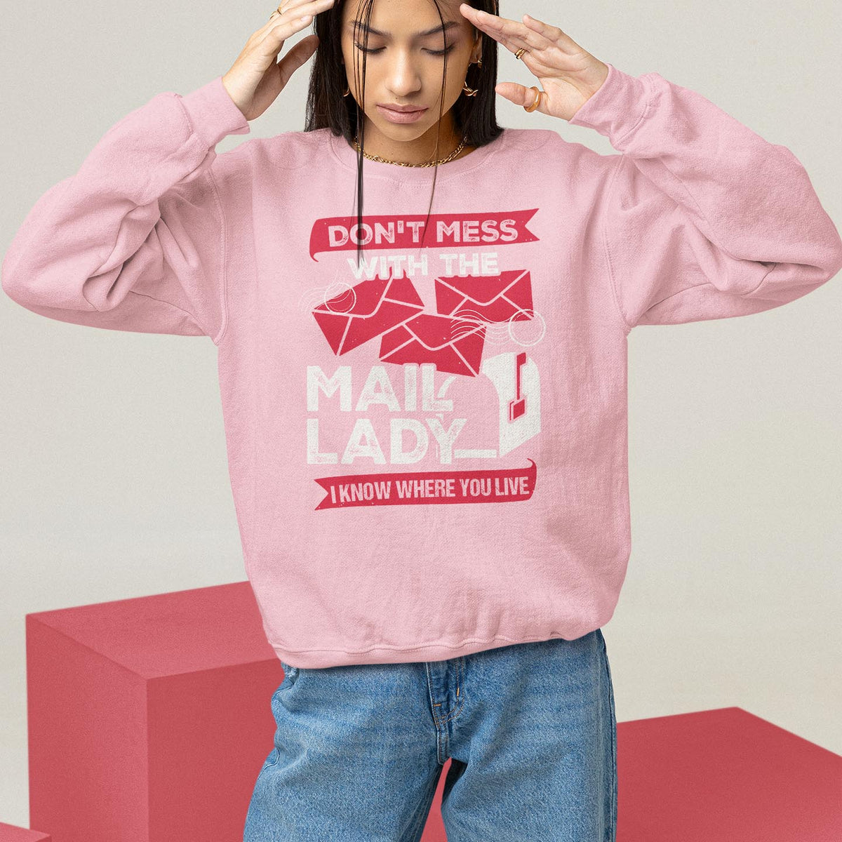Light pink postal worker sweatshirt with “Mail Lady” graphic and red slogan