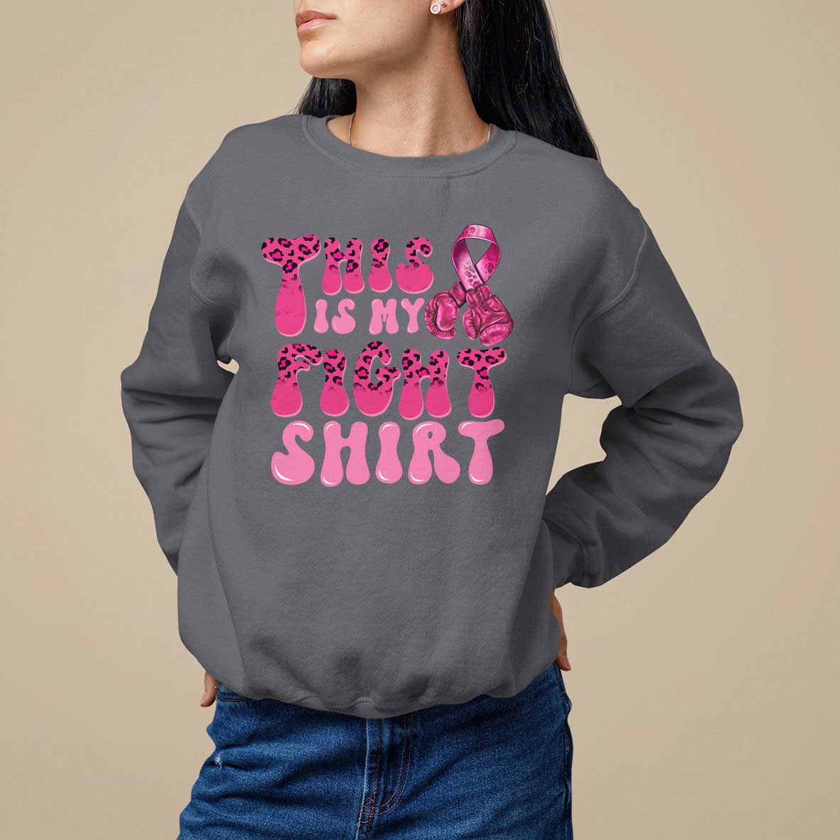 Charcoal gray crewneck sweatshirt with pink ribbon awareness graphic and bold pink text