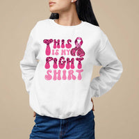 White crewneck sweatshirt with pink ribbon awareness graphic and bold pink text