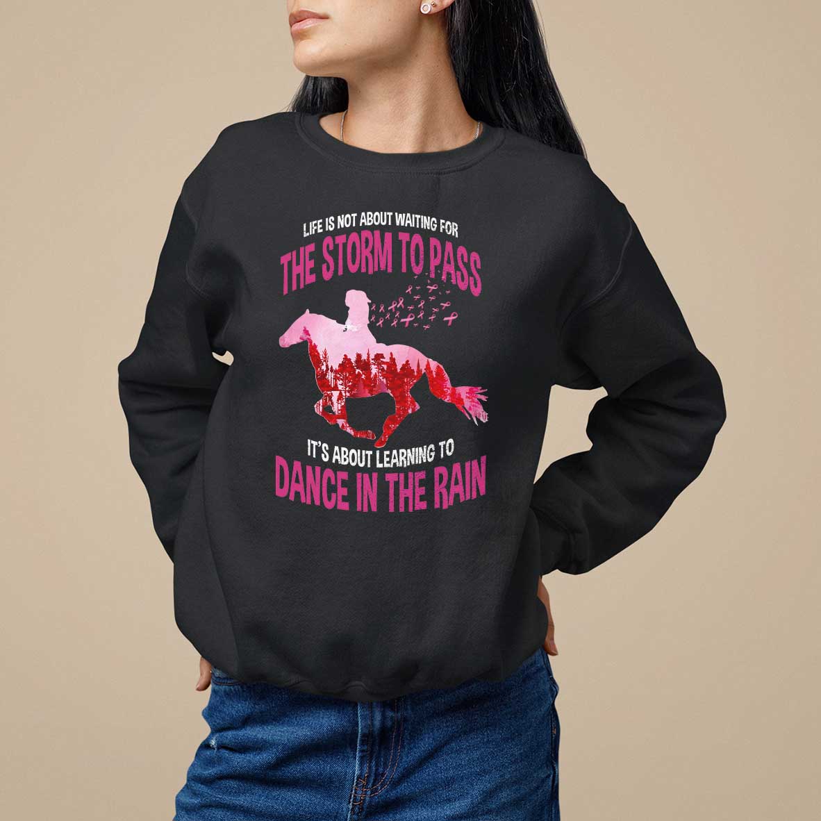 Black women's sweatshirt with horse graphic and 'The storm to pass' slogan on front