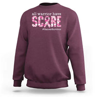 Maroon crewneck sweatshirt with 'all warrior have scars' and #CancerSurvivor graphic