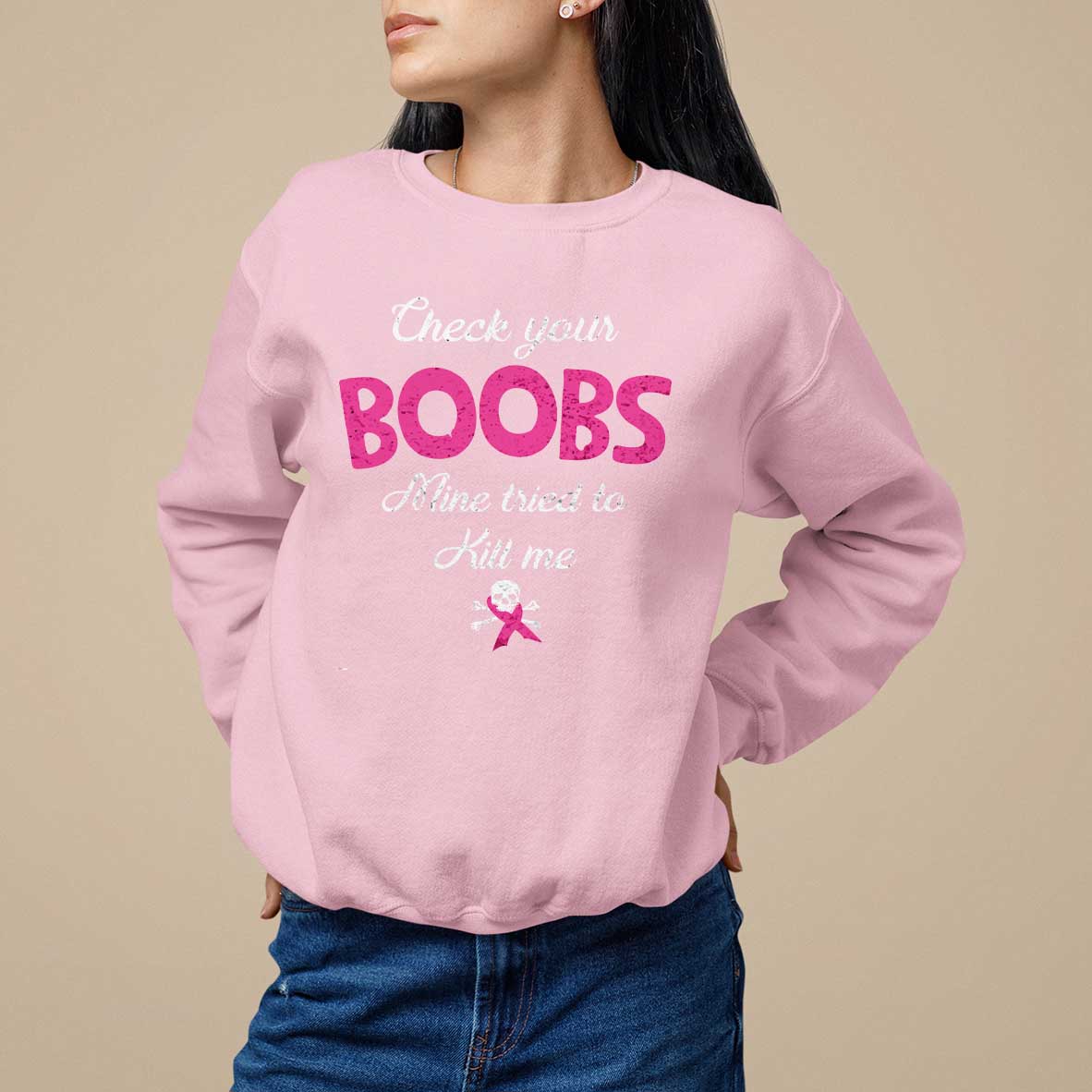Light pink women’s awareness sweatshirt with pink ribbon and “Check your BOOBS” graphic.