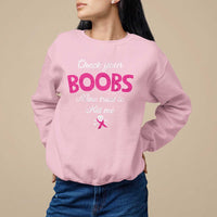Light pink women’s awareness sweatshirt with pink ribbon and “Check your BOOBS” graphic.