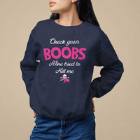 Navy women’s awareness sweatshirt with pink ribbon and “Check your BOOBS” graphic.