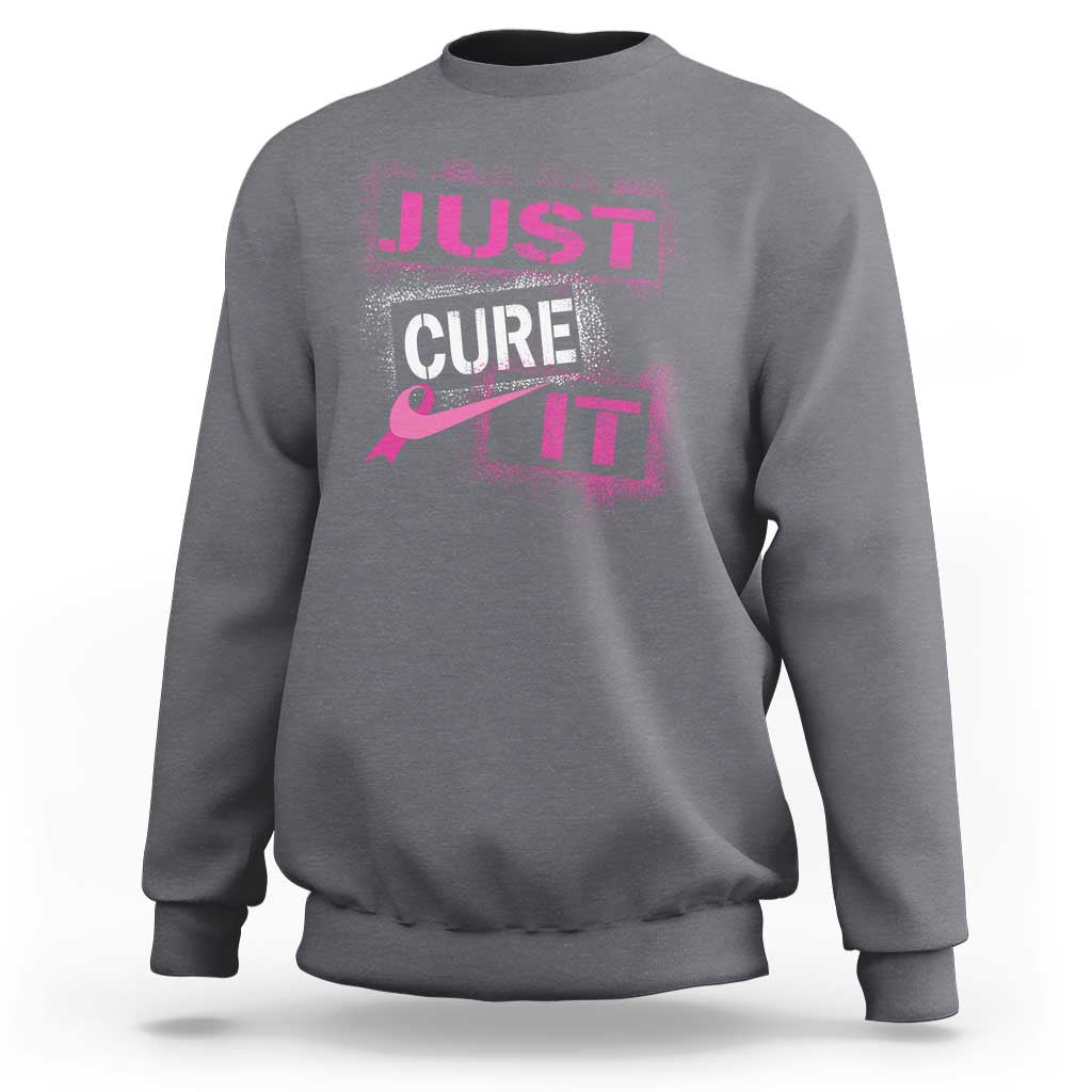 Charcoal gray breast cancer awareness sweatshirt with “Just Cure It” chest graphic