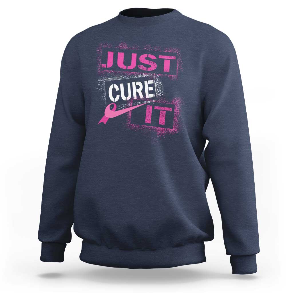 Navy breast cancer awareness sweatshirt with “Just Cure It” chest graphic