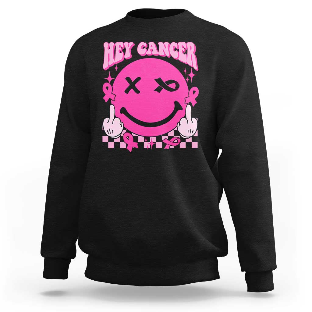 Black crewneck sweatshirt with pink cancer-themed smiley graphic on the front