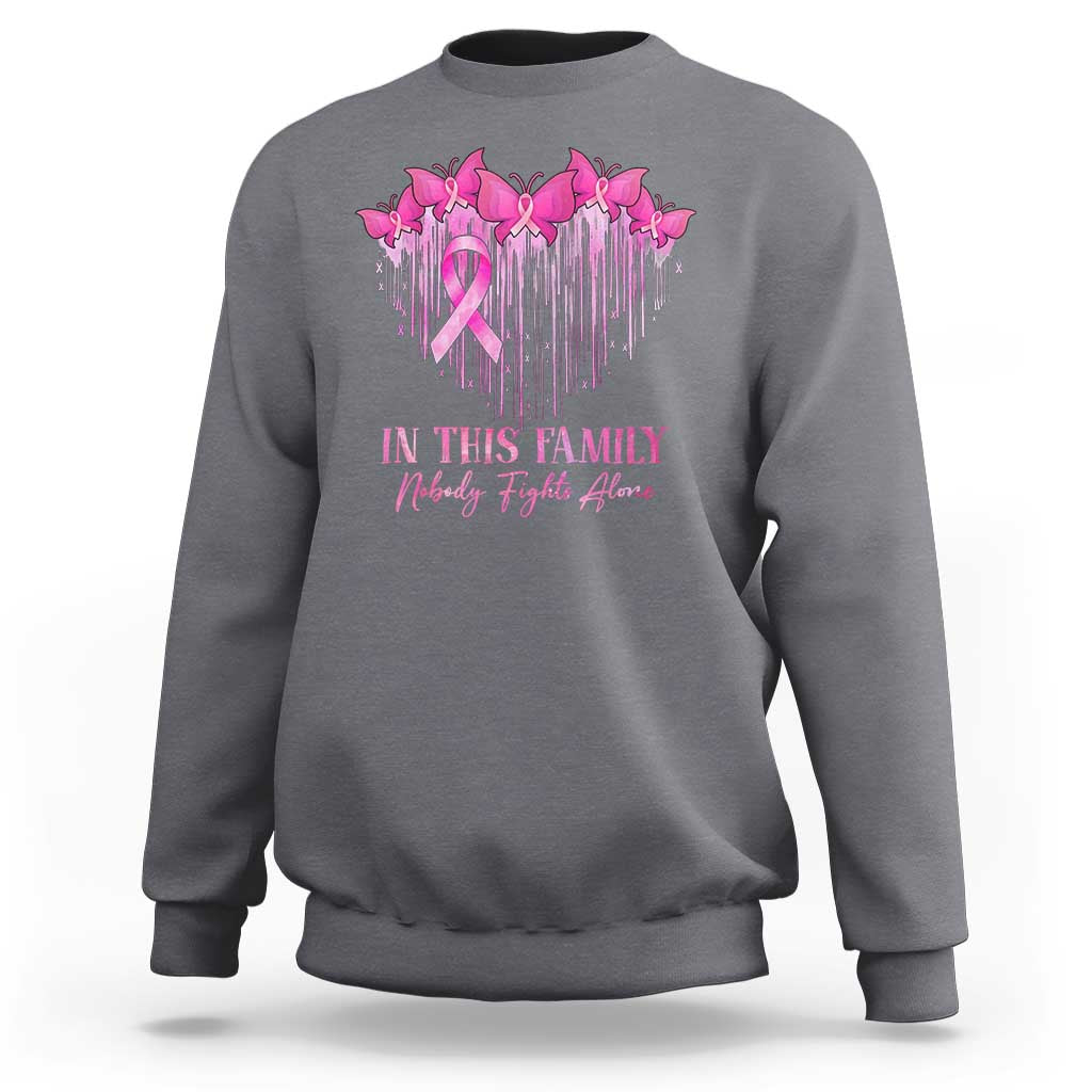 Light gray crewneck sweatshirt with pink ribbon and birds graphic plus family message text.