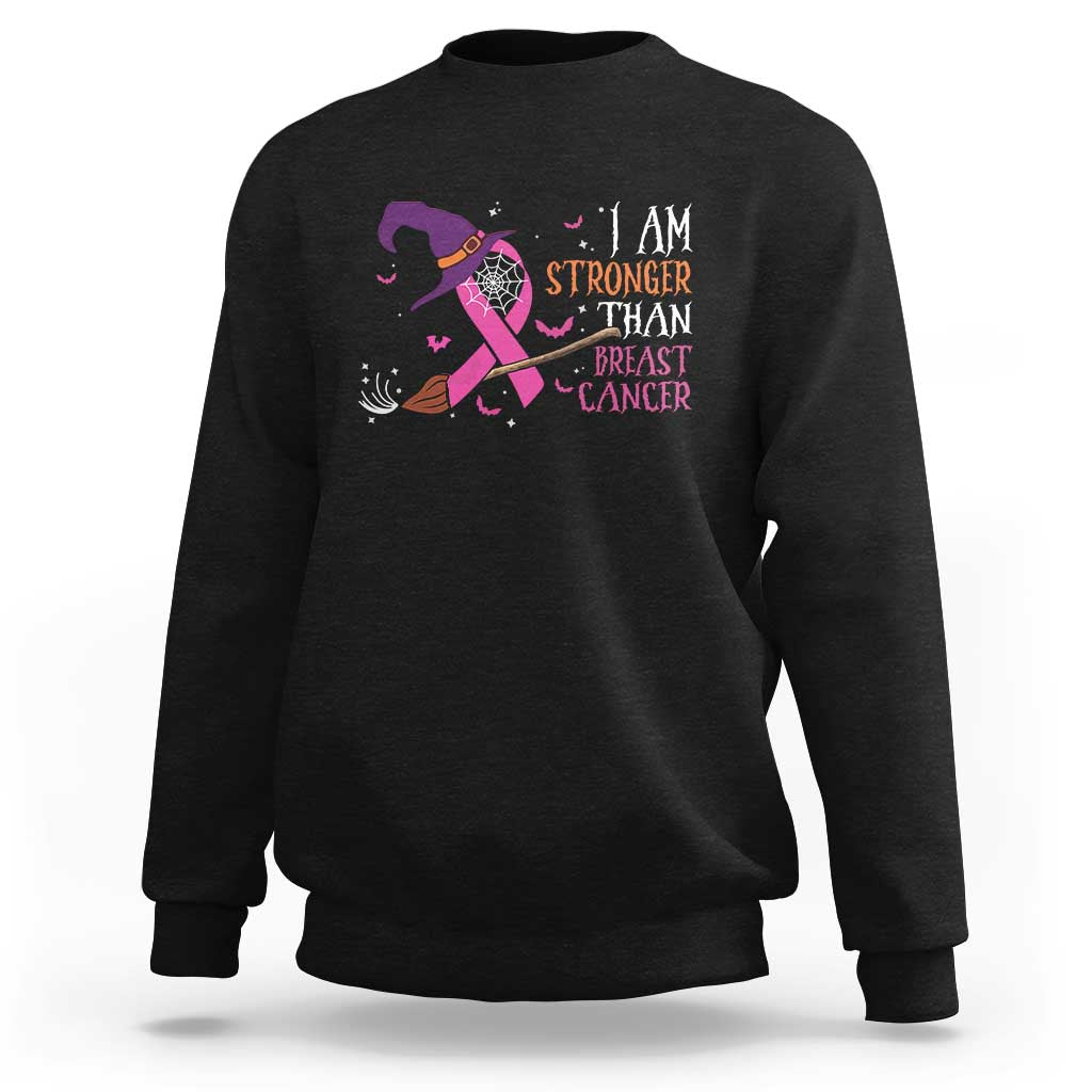 Black crewneck sweatshirt with pink ribbon witch graphic and “I AM STRONGER” text