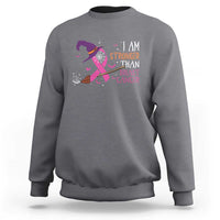 Charcoal crewneck sweatshirt with pink ribbon witch graphic and “I AM STRONGER” text