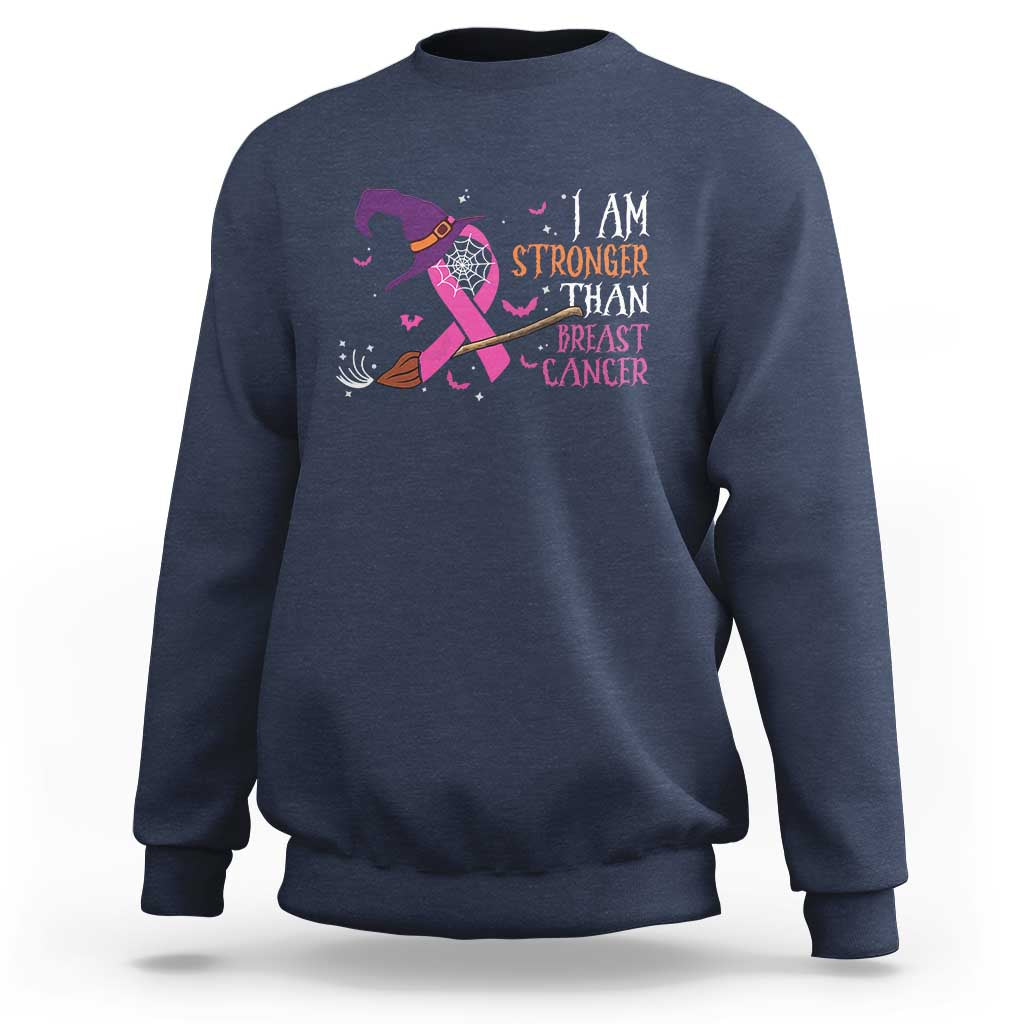 Navy crewneck sweatshirt with pink ribbon witch graphic and “I AM STRONGER” text