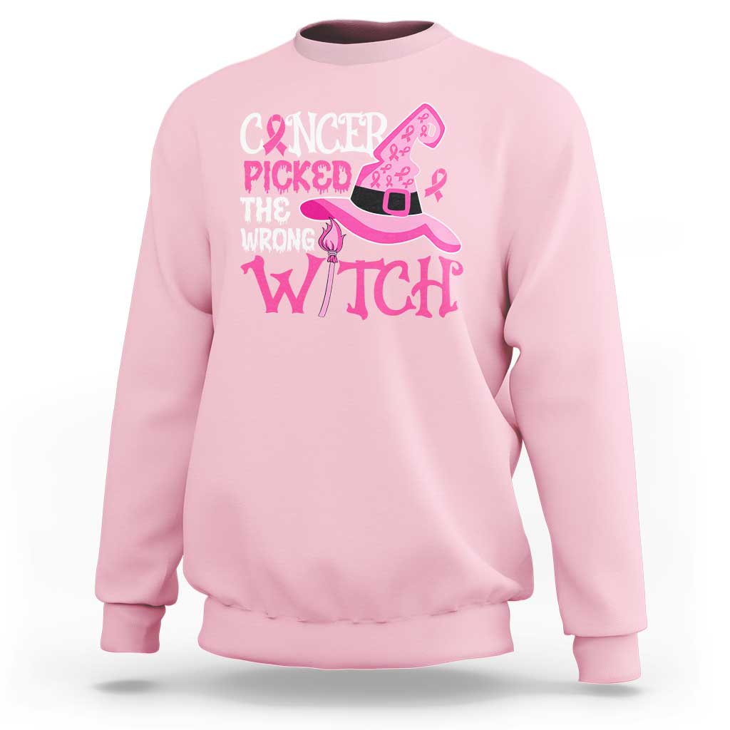 Light pink crewneck sweatshirt with pink cancer-witch graphic on front