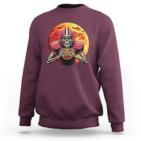 Maroon crewneck sweatshirt with skeleton football player graphic on the front