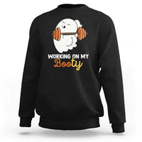 Black crewneck sweatshirt with ghost lifting barbell graphic and “Working on My Booty” text
