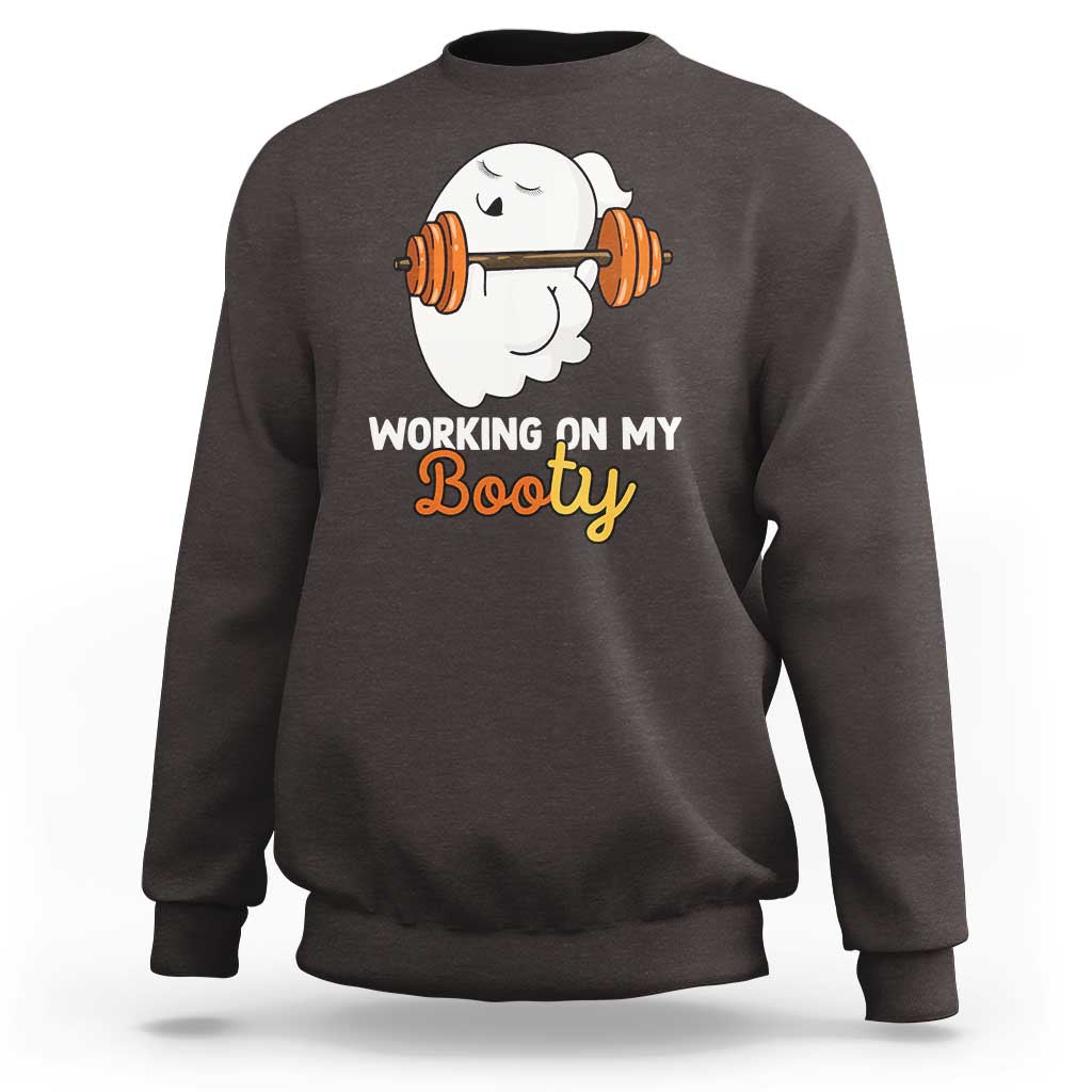 Dark chocolate crewneck sweatshirt with ghost lifting barbell graphic and “Working on My Booty” text