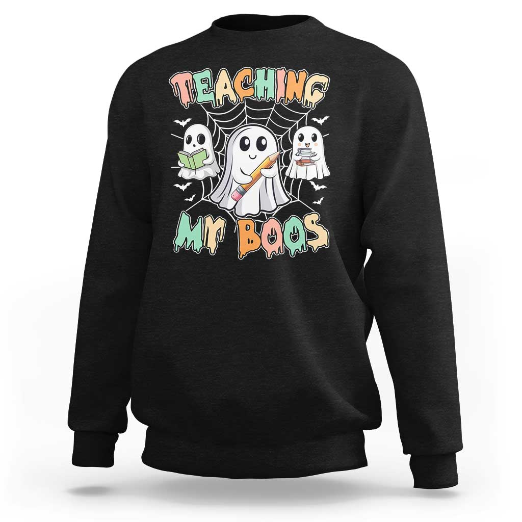 Black Halloween teacher sweatshirt with cute ghost graphic and Teaching My Boos text