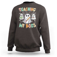 Dark chocolate Halloween teacher sweatshirt with cute ghost graphic and Teaching My Boos text