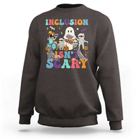 Dark chocolate sweatshirt back graphic: 'Inclusion Isn't Scary' with Halloween characters