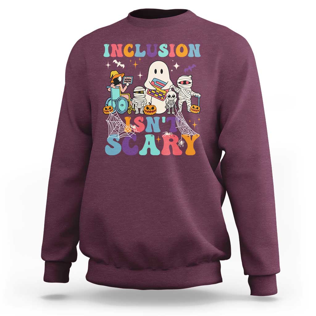 Maroon sweatshirt back graphic: 'Inclusion Isn't Scary' with Halloween characters