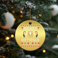 Gold round Christmas ornament with red “Merry Gothmas” gothic graphic and hanging loop