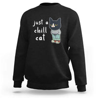 Black cat graphic crewneck sweatshirt with 'just a chill cat' text