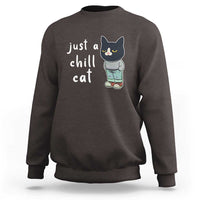 Charcoal cat graphic crewneck sweatshirt with 'just a chill cat' text