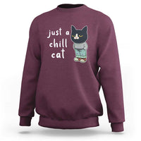 Maroon cat graphic crewneck sweatshirt with 'just a chill cat' text