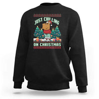 Black crewneck sweatshirt with Christmas graphic: JUST CHILLING ON CHRISTMAS