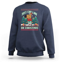 Navy blue crewneck sweatshirt with Christmas graphic: JUST CHILLING ON CHRISTMAS