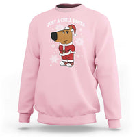 Light pink crewneck sweatshirt with "Just a Chill Santa" cartoon graphic on front