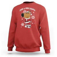 Red crewneck sweatshirt with "Just a Chill Santa" cartoon graphic on front