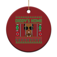 Red circular Christmas ornament with 'DIDDY'S HOME' front graphic, hanging gold string.