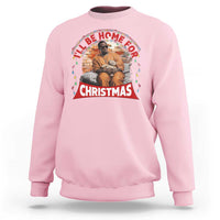 Light pink crewneck sweatshirt with front Christmas graphic and greeting-style arch