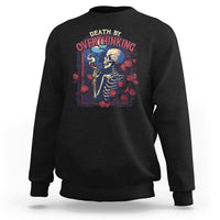 Black crewneck sweatshirt with skeleton smoking graphic on front