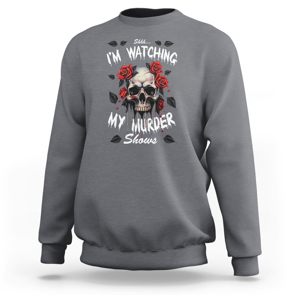 Charcoal gray crewneck sweatshirt with skull and roses graphic on the chest, long sleeves.