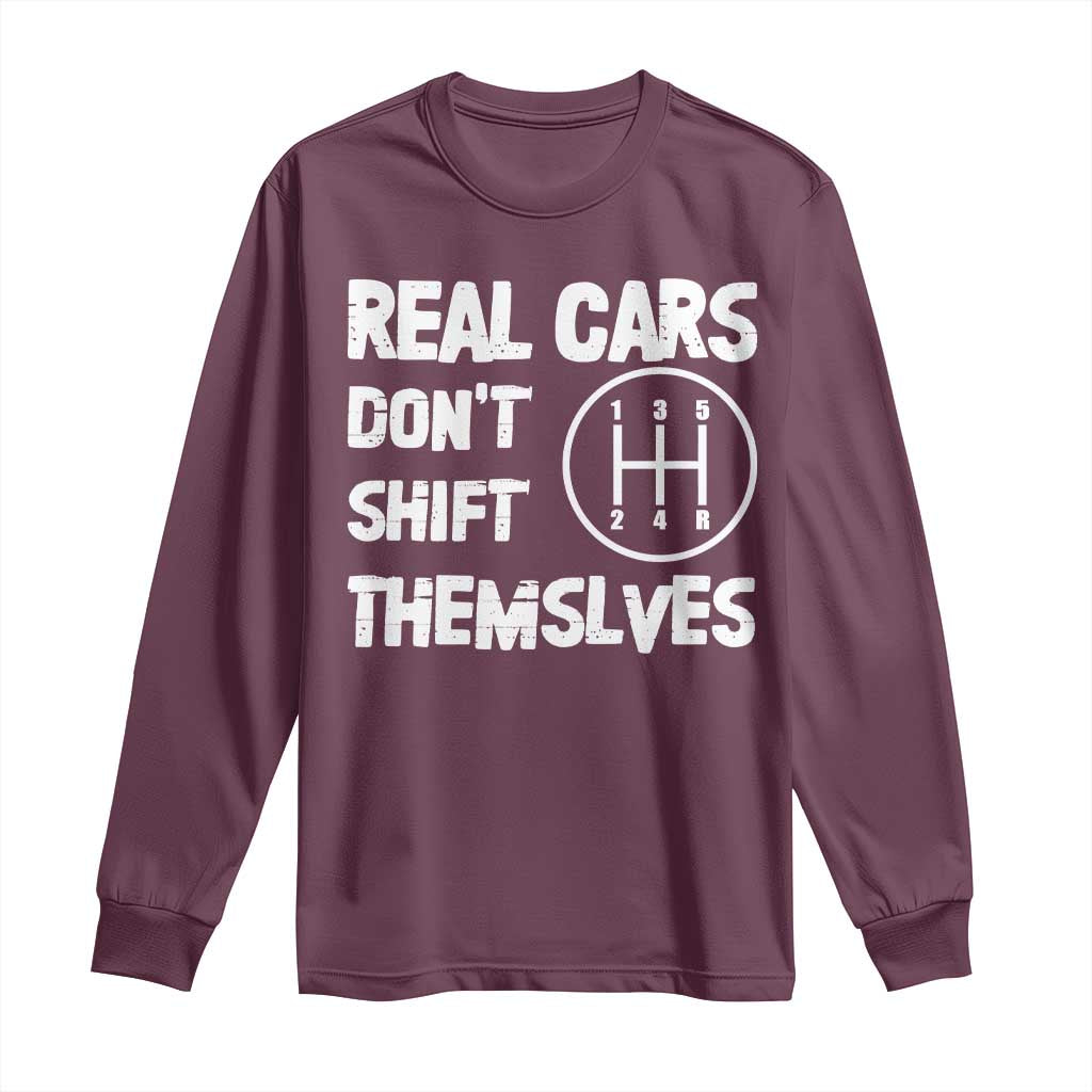 Maroon long sleeve T-shirt with “REAL CARS DON’T SHIFT THEMSELVES” graphic