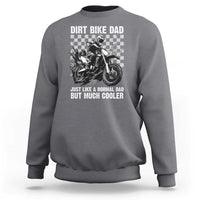 Charcoal gray long-sleeve sweatshirt with dirt bike graphic and bold text on the chest