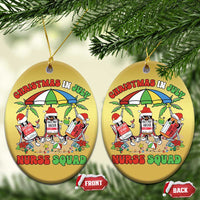 Two gold round Christmas ornaments with Nurse Squad graphic, hanging from tree branches.