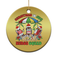 Gold round Christmas ornament with Nurse Squad illustration and hanging gold cord.