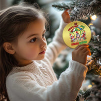 Gold round Christmas ornament with Nurse Squad graphic, hanging from a tree branch.