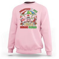 Light pink crewneck sweatshirt with colorful Nurse Squad holiday graphic on front