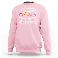 Light pink crewneck sweatshirt with 'We the People means everyone' patriotic graphic