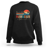 Black crewneck sweatshirt with long sleeves and 'Hawaiian' beach graphic print